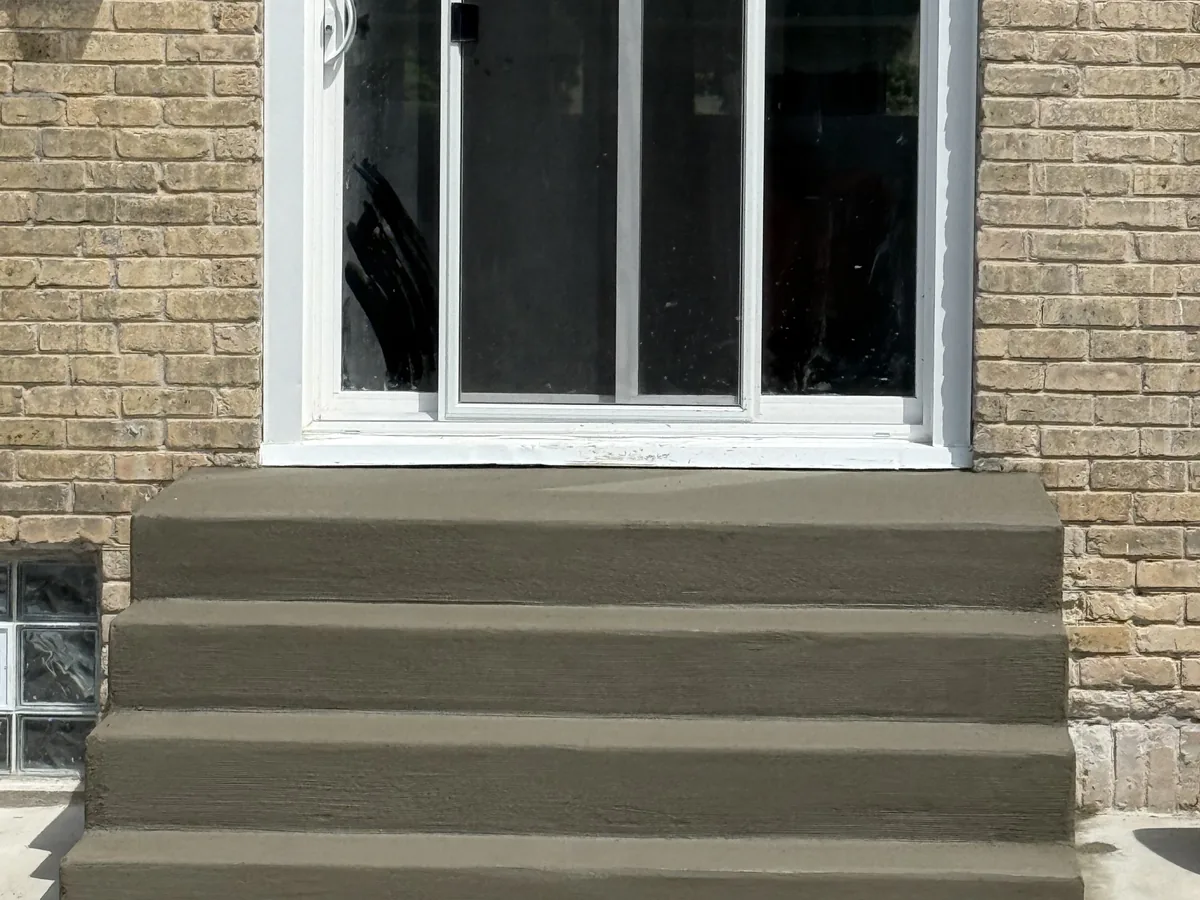 New concrete steps poured at a patio door